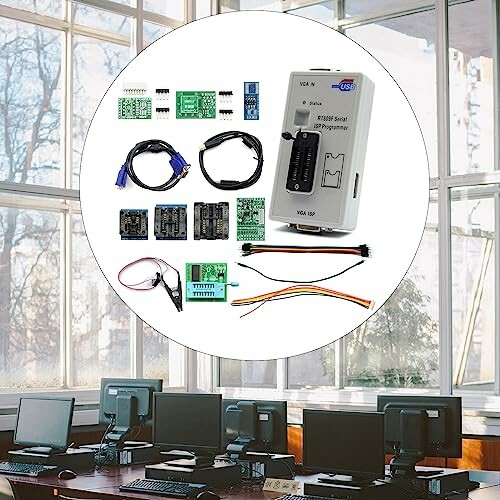 Electronic components kit displayed over an office background with computers.